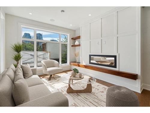 1-742 Memorial Drive Nw, Calgary, AB - Indoor Photo Showing Living Room With Fireplace