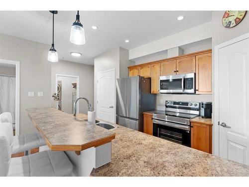 206-4403 67A Avenue, Olds, AB - Indoor Photo Showing Kitchen With Stainless Steel Kitchen With Double Sink