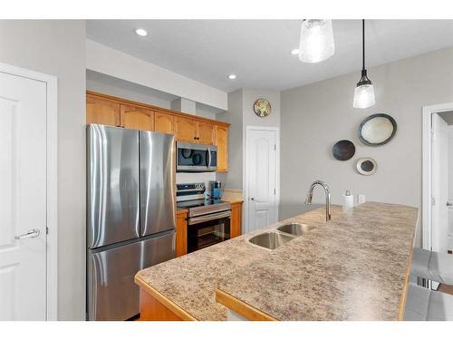 206-4403 67A Avenue, Olds, AB - Indoor Photo Showing Kitchen With Stainless Steel Kitchen With Double Sink