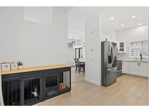 59 River Rock Way Se, Calgary, AB - Indoor Photo Showing Kitchen With Fireplace