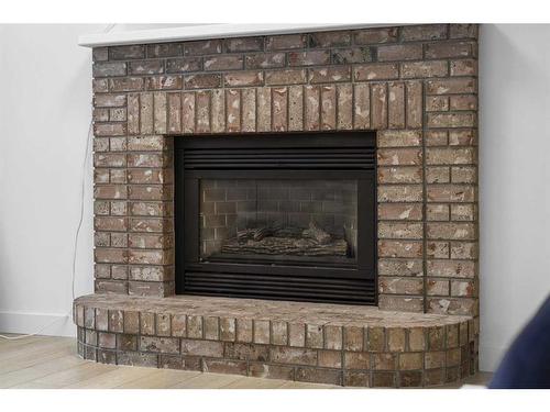 59 River Rock Way Se, Calgary, AB - Indoor Photo Showing Living Room With Fireplace