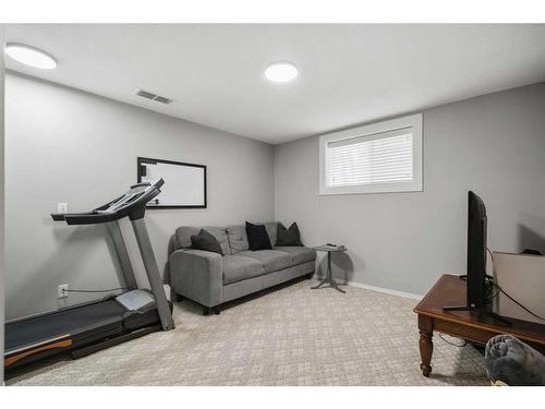 59 River Rock Way Se, Calgary, AB - Indoor Photo Showing Gym Room