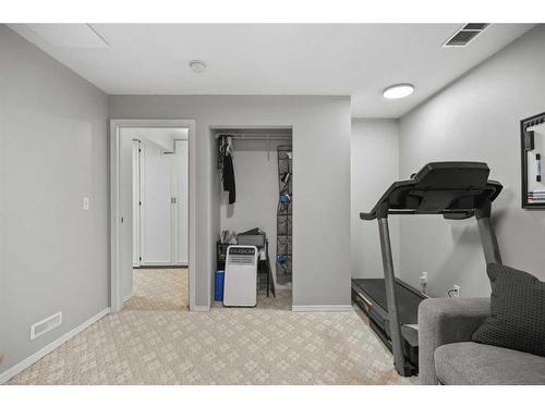 59 River Rock Way Se, Calgary, AB - Indoor Photo Showing Gym Room