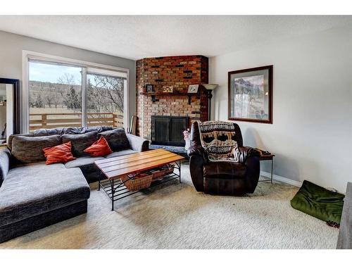 5202 Bowness Road Nw, Calgary, AB - Indoor Photo Showing Living Room With Fireplace