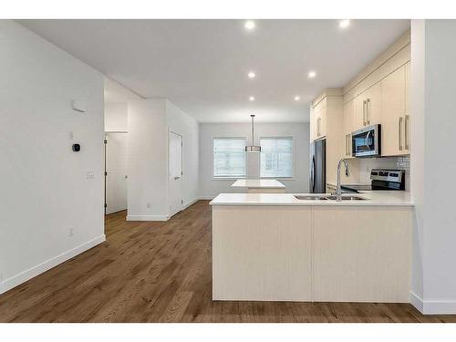 142 Savanna Street Ne, Calgary, AB - Indoor Photo Showing Kitchen With Double Sink