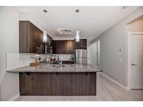 201-20 Sage Hill Terrace Nw, Calgary, AB - Indoor Photo Showing Kitchen With Double Sink With Upgraded Kitchen