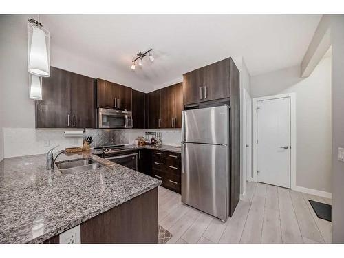 201-20 Sage Hill Terrace Nw, Calgary, AB - Indoor Photo Showing Kitchen With Stainless Steel Kitchen With Double Sink With Upgraded Kitchen