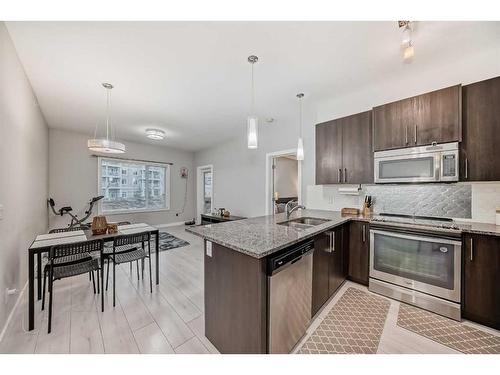 201-20 Sage Hill Terrace Nw, Calgary, AB - Indoor Photo Showing Kitchen With Stainless Steel Kitchen With Upgraded Kitchen