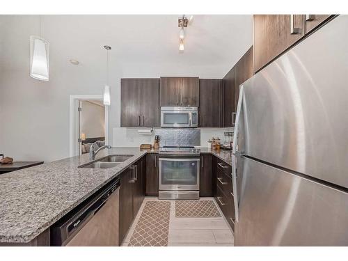 201-20 Sage Hill Terrace Nw, Calgary, AB - Indoor Photo Showing Kitchen With Stainless Steel Kitchen With Double Sink With Upgraded Kitchen