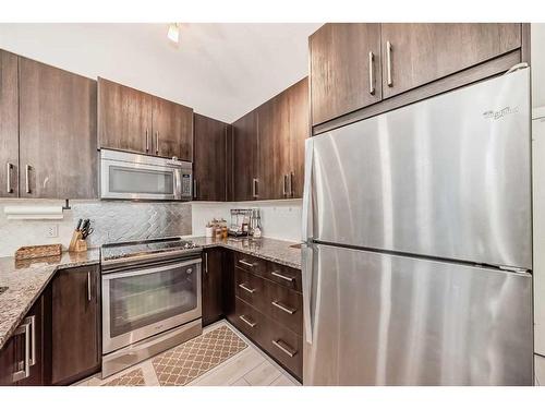 201-20 Sage Hill Terrace Nw, Calgary, AB - Indoor Photo Showing Kitchen With Stainless Steel Kitchen With Upgraded Kitchen