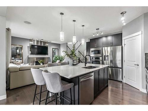 133 Drake Landing Heath, Okotoks, AB - Indoor Photo Showing Kitchen With Double Sink With Upgraded Kitchen