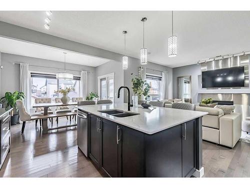 133 Drake Landing Heath, Okotoks, AB - Indoor Photo Showing Kitchen With Double Sink With Upgraded Kitchen