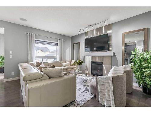 133 Drake Landing Heath, Okotoks, AB - Indoor Photo Showing Living Room With Fireplace