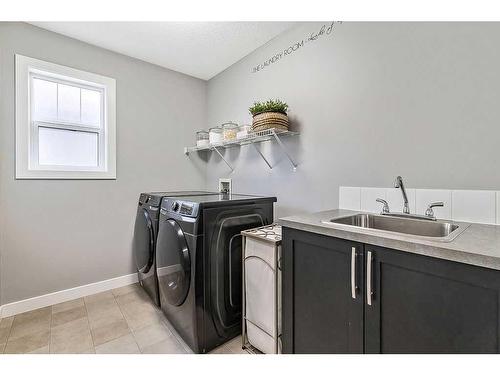 133 Drake Landing Heath, Okotoks, AB - Indoor Photo Showing Laundry Room