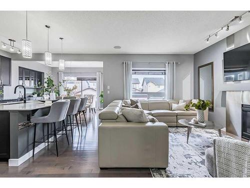 133 Drake Landing Heath, Okotoks, AB - Indoor Photo Showing Living Room With Fireplace