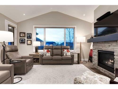 84 Clear Creek Place, Rural Rocky View County, AB - Indoor Photo Showing Living Room With Fireplace