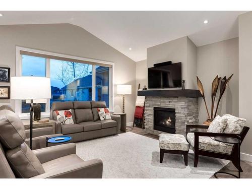 84 Clear Creek Place, Rural Rocky View County, AB - Indoor Photo Showing Living Room With Fireplace