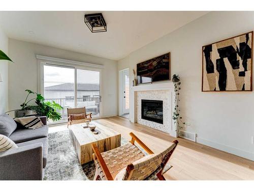 2227 32 Avenue Sw, Calgary, AB - Indoor Photo Showing Living Room With Fireplace