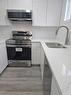 9-801 6 Street, Canmore, AB  - Indoor Photo Showing Kitchen With Double Sink 