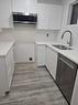 9-801 6 Street, Canmore, AB  - Indoor Photo Showing Kitchen With Double Sink 