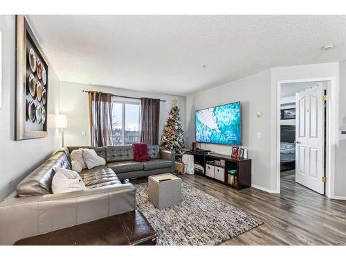 311-1000 Somervale Court Sw, Calgary, AB - Indoor Photo Showing Living Room