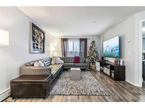 311-1000 Somervale Court Sw, Calgary, AB - Indoor Photo Showing Living Room