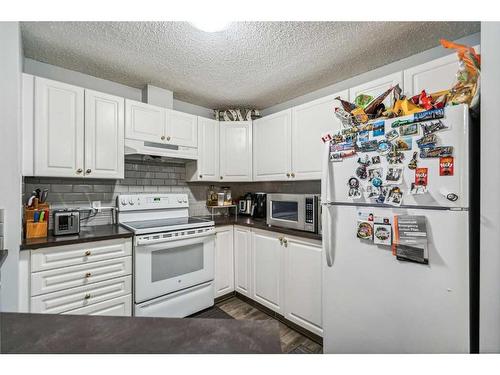 311-1000 Somervale Court Sw, Calgary, AB - Indoor Photo Showing Kitchen