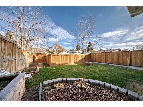 908 Riverbend Drive Se, Calgary, AB - Outdoor With Backyard