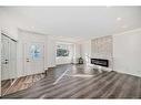 908 Riverbend Drive Se, Calgary, AB  - Indoor Photo Showing Living Room With Fireplace 