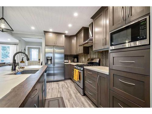 664 Royalite Way Se, Diamond Valley, AB - Indoor Photo Showing Kitchen With Upgraded Kitchen