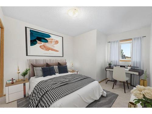 29 Crystal Shores Crescent, Okotoks, AB - Indoor Photo Showing Bedroom