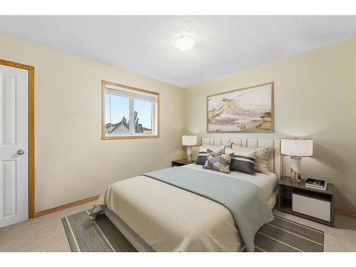 29 Crystal Shores Crescent, Okotoks, AB - Indoor Photo Showing Bedroom