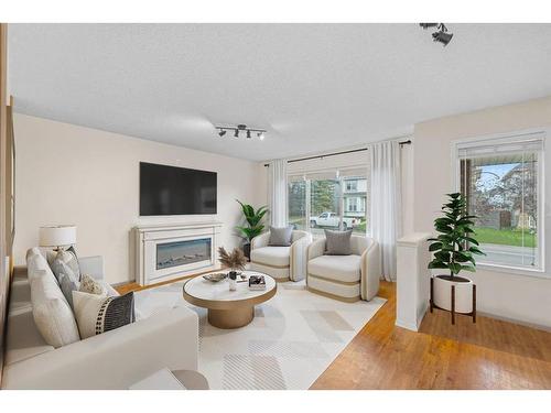 29 Crystal Shores Crescent, Okotoks, AB - Indoor Photo Showing Living Room With Fireplace