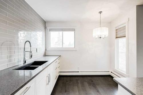 302-1721 13 Street Sw, Calgary, AB - Indoor Photo Showing Kitchen With Double Sink