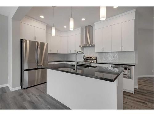 199 Silver Spruce Grove Sw, Calgary, AB - Indoor Photo Showing Kitchen With Double Sink With Upgraded Kitchen