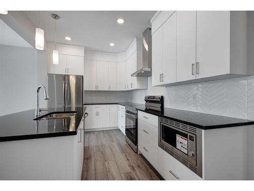 199 Silver Spruce Grove Sw, Calgary, AB - Indoor Photo Showing Kitchen With Upgraded Kitchen