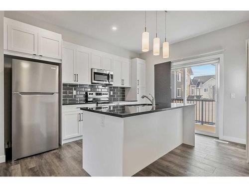 484 Canals Crossing Sw, Airdrie, AB - Indoor Photo Showing Kitchen With Stainless Steel Kitchen With Upgraded Kitchen