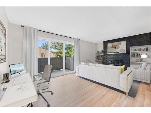 104-9803 24 Street Sw, Calgary, AB - Indoor Photo Showing Living Room