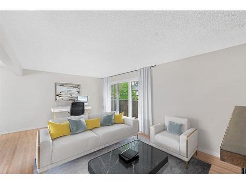 104-9803 24 Street Sw, Calgary, AB - Indoor Photo Showing Living Room