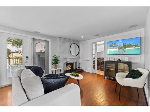 3 Stranraer Place Sw, Calgary, AB - Indoor Photo Showing Living Room With Fireplace