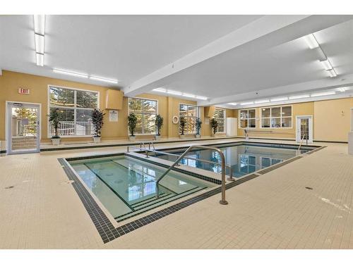 213-728 Country Hills Road Nw, Calgary, AB - Indoor Photo Showing Other Room With In Ground Pool