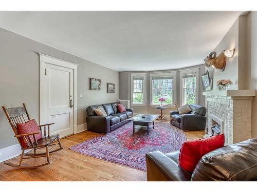 2-904 Memorial Drive Nw, Calgary, AB - Indoor Photo Showing Living Room With Fireplace