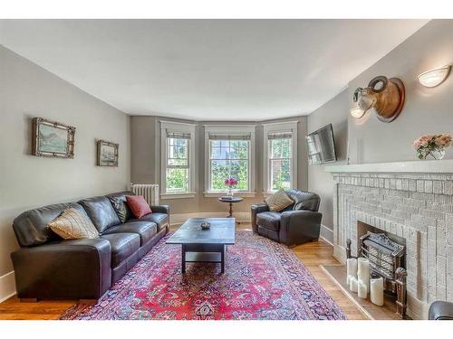 2-904 Memorial Drive Nw, Calgary, AB - Indoor Photo Showing Living Room With Fireplace