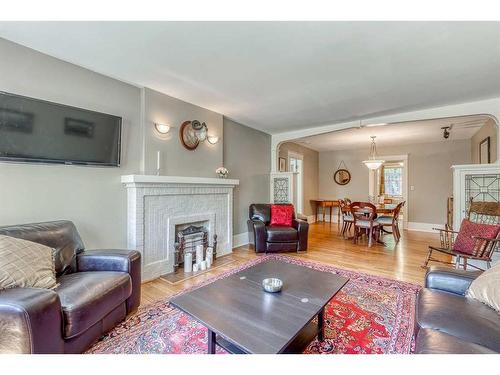 2-904 Memorial Drive Nw, Calgary, AB - Indoor Photo Showing Living Room With Fireplace