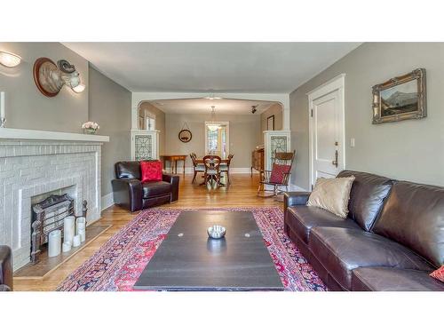 2-904 Memorial Drive Nw, Calgary, AB - Indoor Photo Showing Living Room With Fireplace