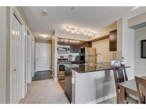 1313-81 Legacy Boulevard Se, Calgary, AB - Indoor Photo Showing Kitchen With Stainless Steel Kitchen With Double Sink