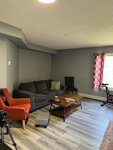 103-15 Saddlestone Way Ne, Calgary, AB - Indoor Photo Showing Living Room