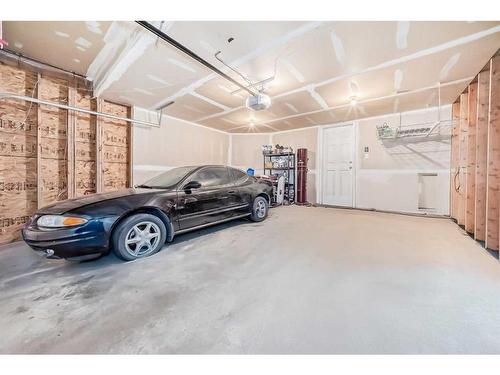 181 Luxstone Road Sw, Airdrie, AB - Indoor Photo Showing Garage