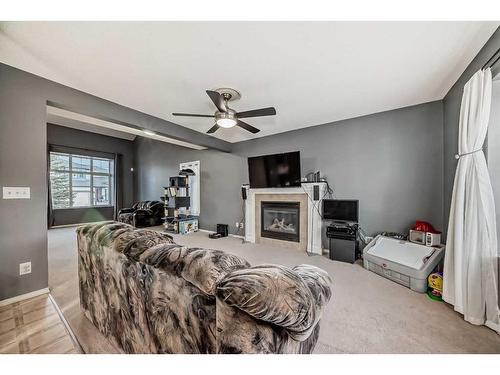 181 Luxstone Road Sw, Airdrie, AB - Indoor With Fireplace