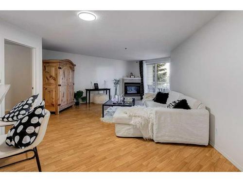 2209-11 Chaparral Ridge Drive Se, Calgary, AB - Indoor Photo Showing Living Room With Fireplace